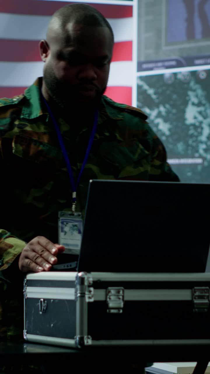 Vertical Video US military personnel work in a modern army command post