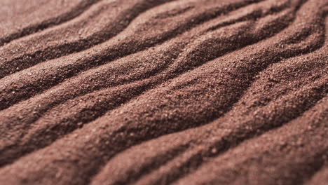 video of close up of brown coloured sand with pattern and copy space background