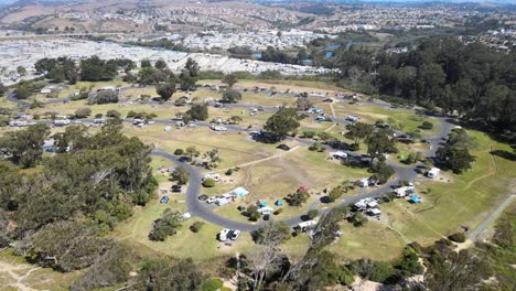 soar above north beach campground in california, capturing its vibrant daytime ambiance, picturesque campgrounds, and stunning mountain backdrop