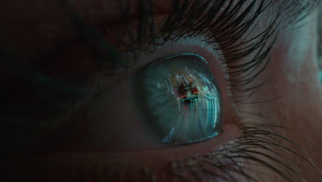 macro eye looking at city skyline at night close up iris reflection human awareness concept