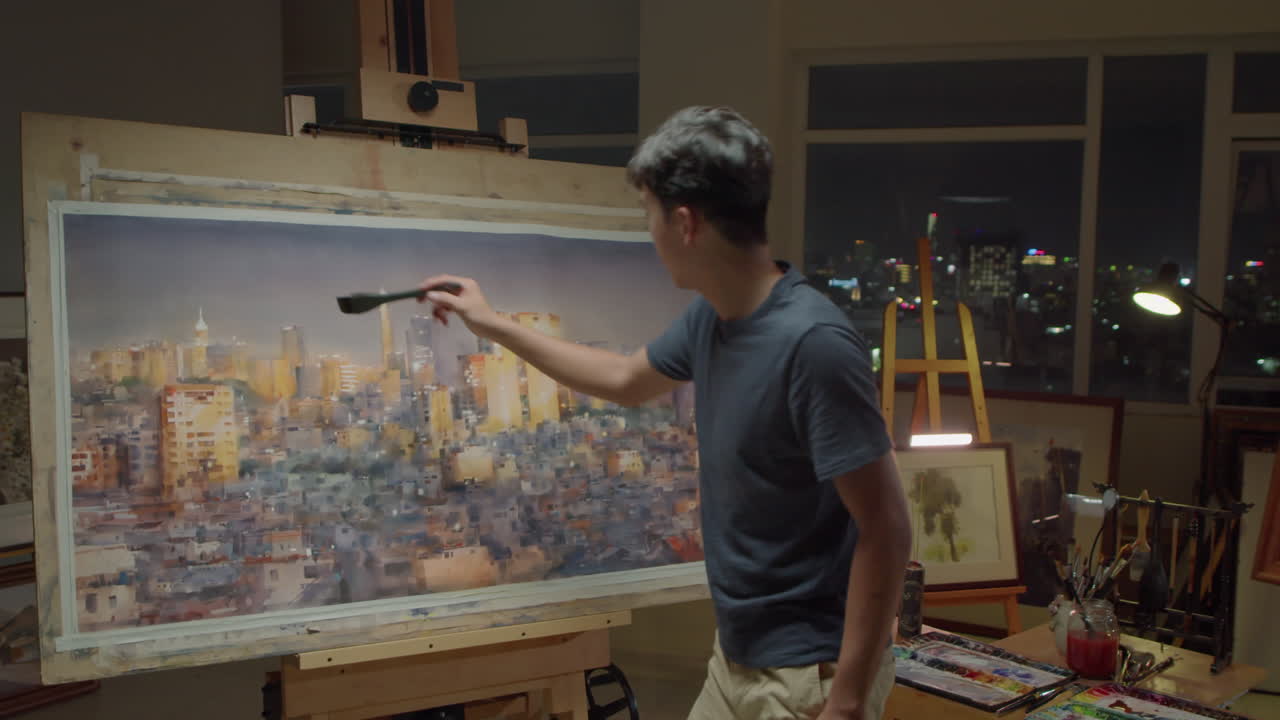 Painter Drawing Night Cityscape in Art Studio