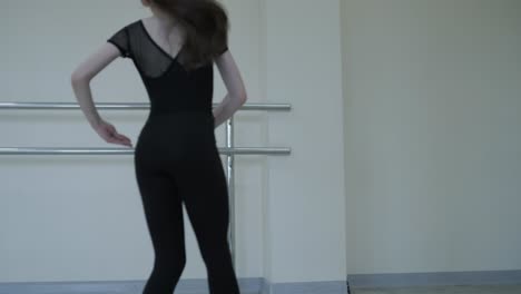 young ballerina practicing dance moves in studio