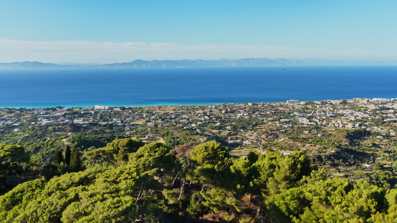 Aerial View of Coastal City with Mountains and Sea