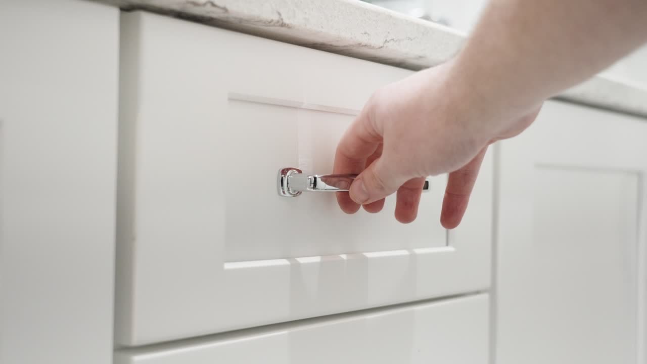Opening up a drawer in a bathroom remodel.