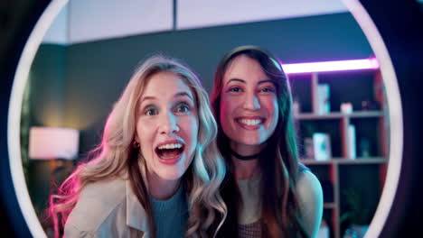 two smiling women embracing