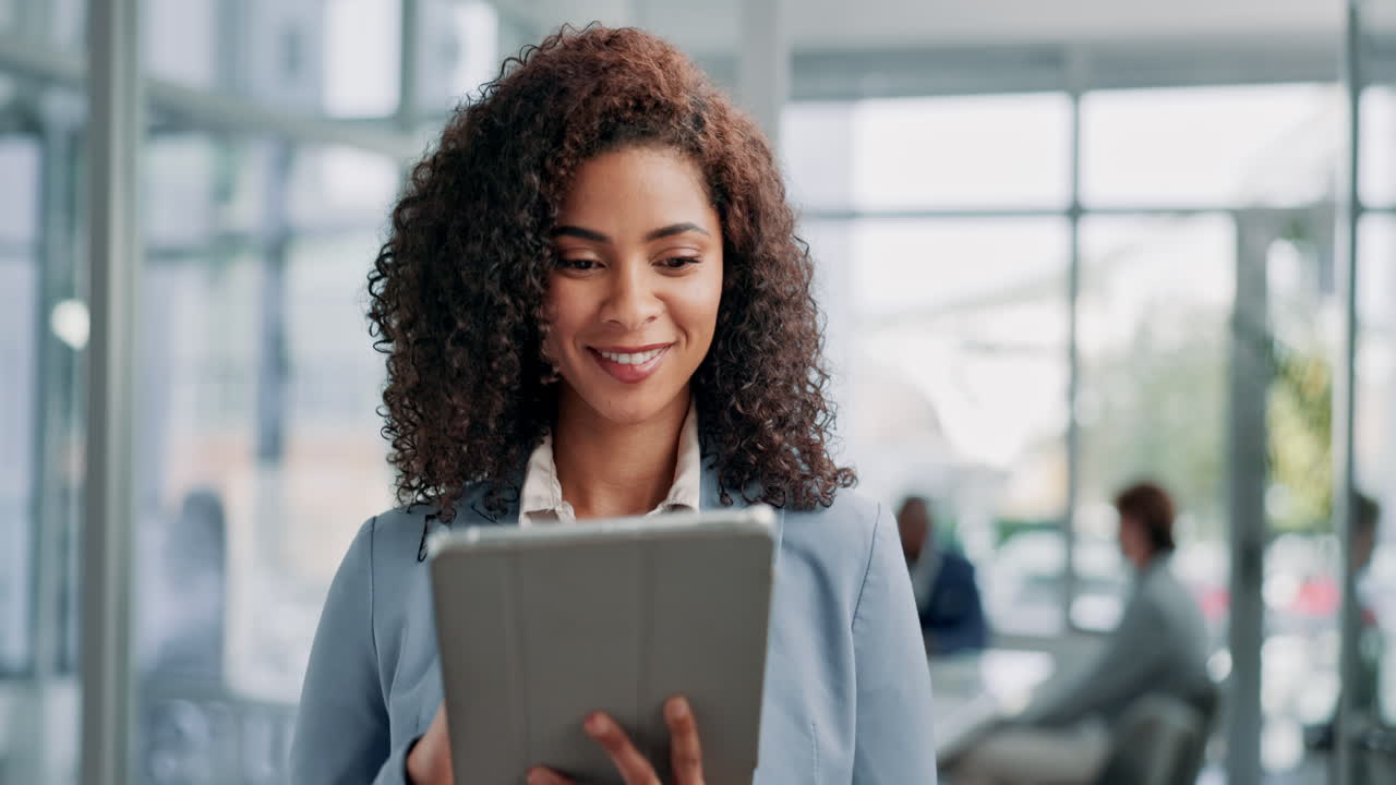 Businesswoman using tablet in modern office