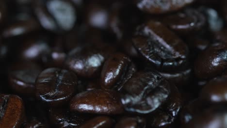 roated coffee beans turning around as seen in a container, food and beverage