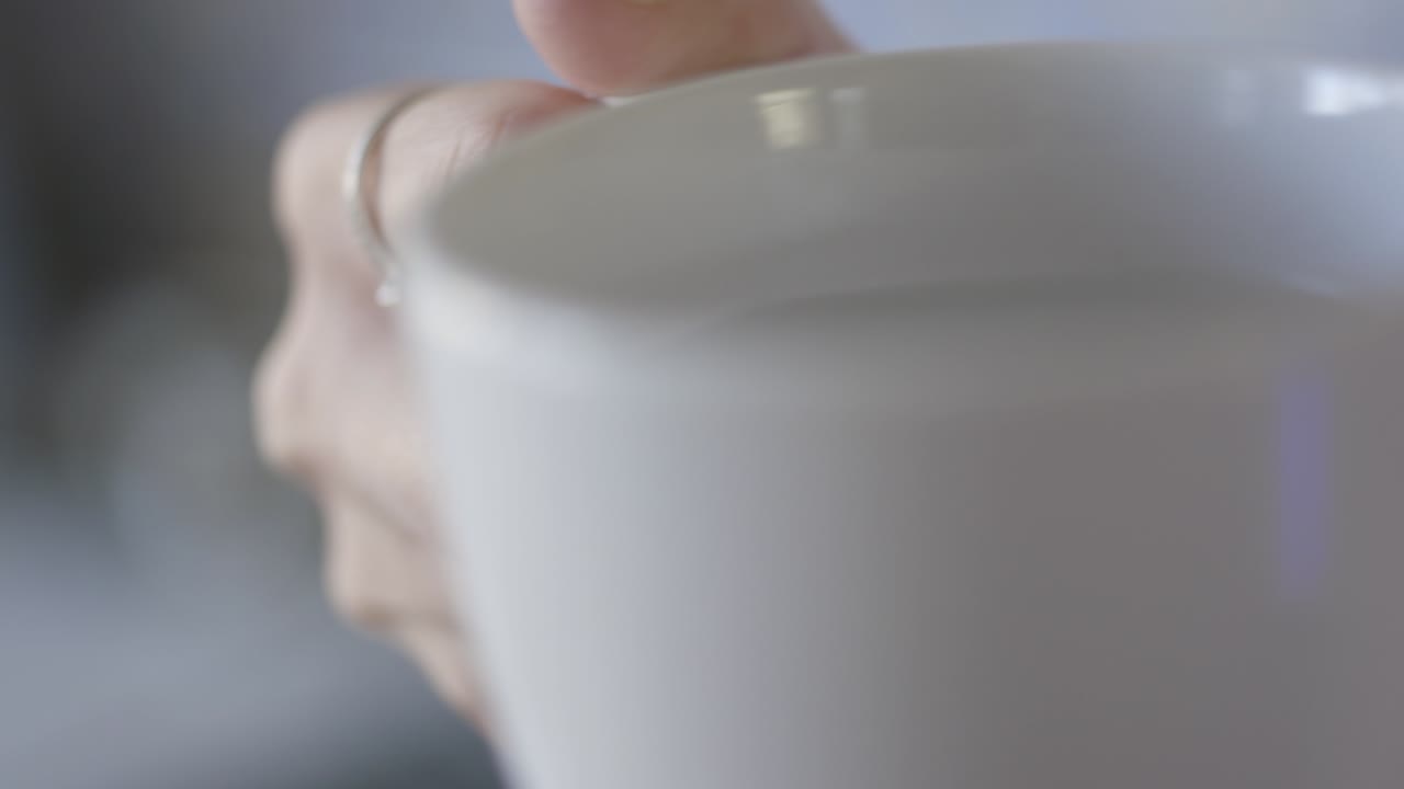 Woman holding a coffee cup