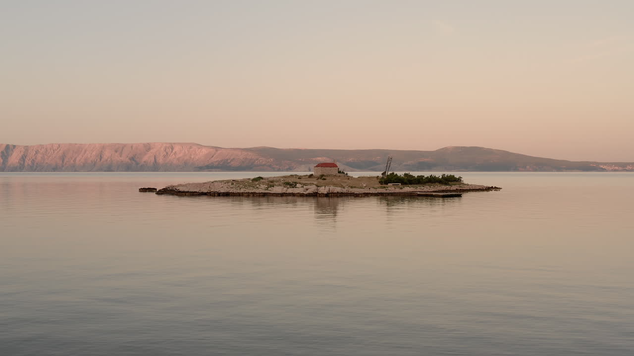 Blue hour view of a tiny island in the middle of the sea