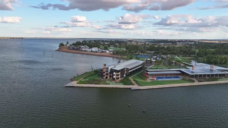 great aerial view of the sebel hotel on the shore of lake mulwala with dead trees and sunlight beyond