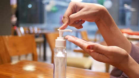applying hand sanitizer