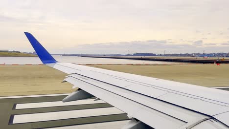 passenger point of view of aircraft wing during take off from new york airport, usa