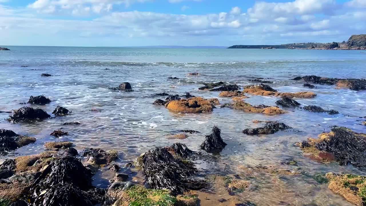 Ireland Epic Locations crystal clear waters on a beach on the Copper Coast Waterford on a bright spring morning