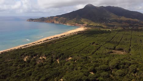 4k-aerial-view-of-beach-of-San-Nicolo'-in-Buggerru,-Sardinia,-establishing