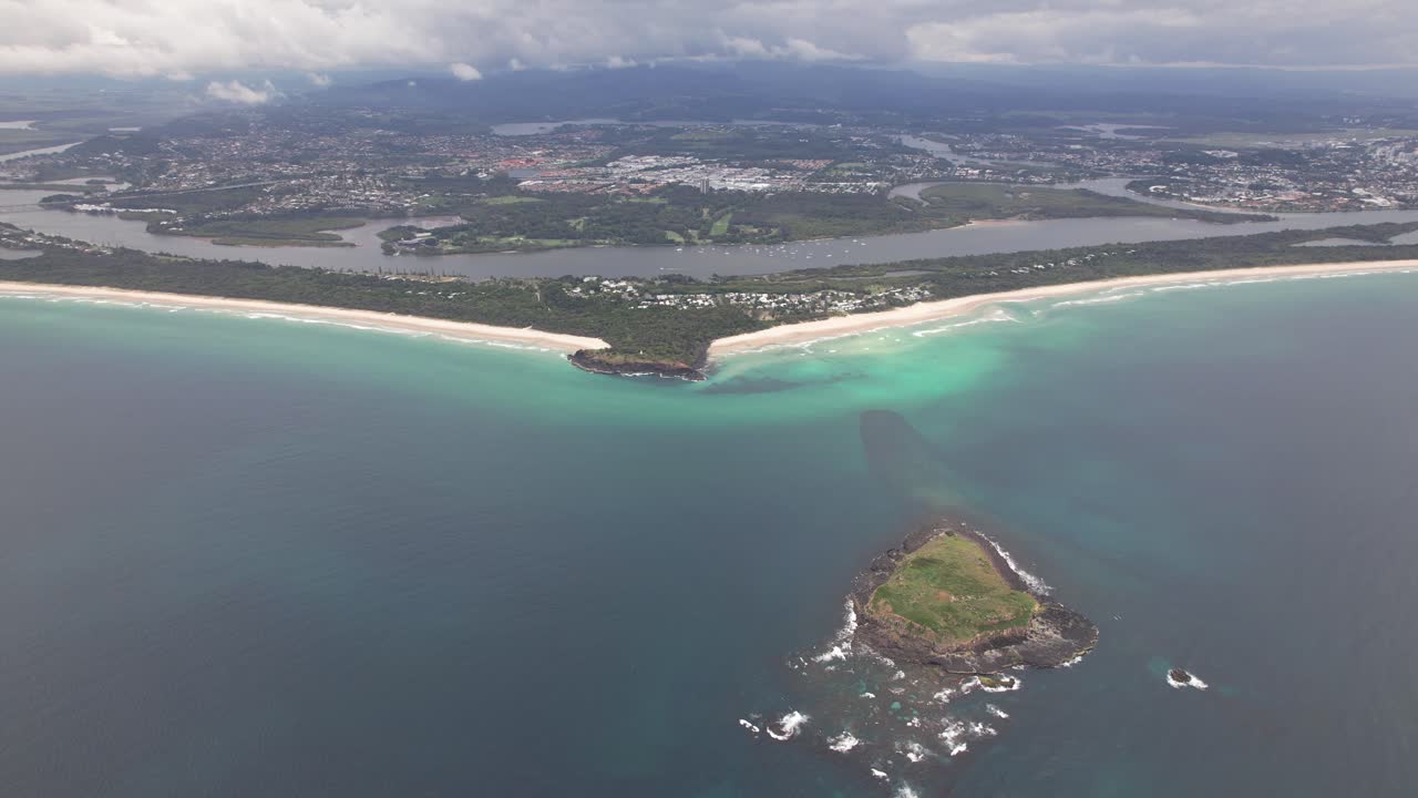 Aerial View of a Coastal Town with a Beautiful Beach and Island