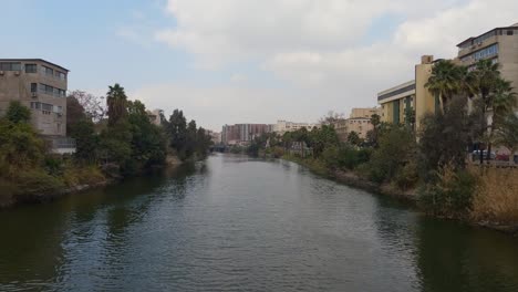 View-of-the-Nile-river-and-the-architecture-of-the-buildings-in-the-city-Cairo,-Egypt