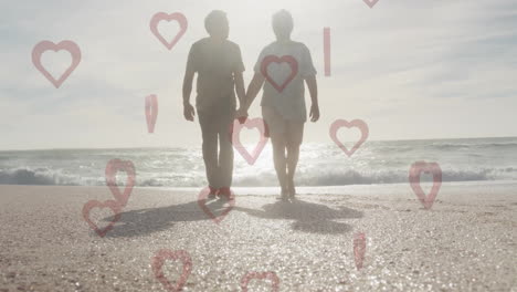 walking on beach, elderly couple holding hands with heart shapes animation
