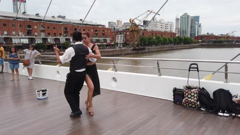 tango intimate dance performance at women's bridge of puerto madero pov