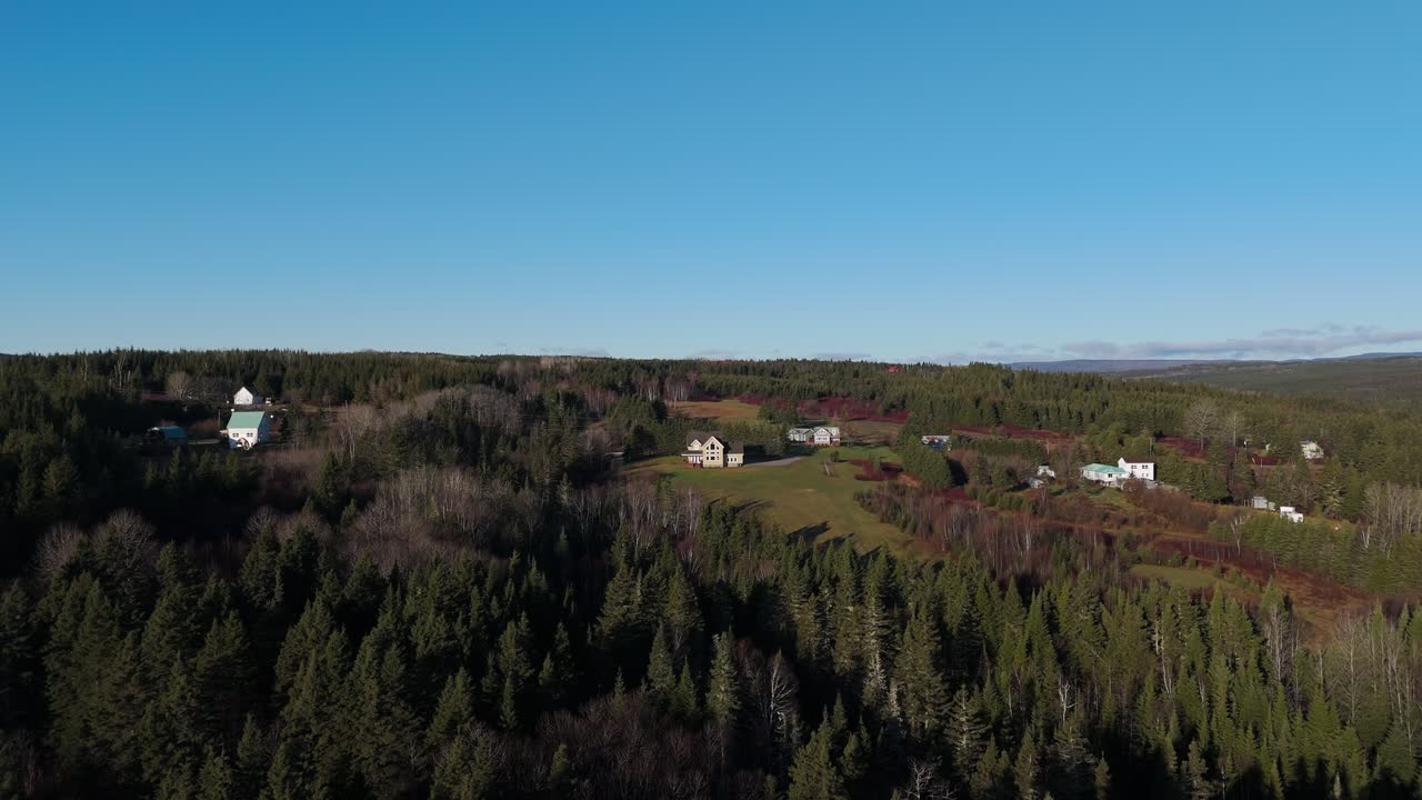 drone shot flying towards a house in a nice rural area in Perc&eacute;, Qu&eacute;bec, Canada