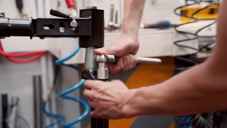 crop mechanic fixing bike with socket wrench