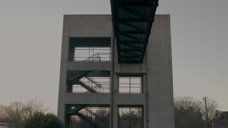 A-large-structure-with-stairs-at-dusk