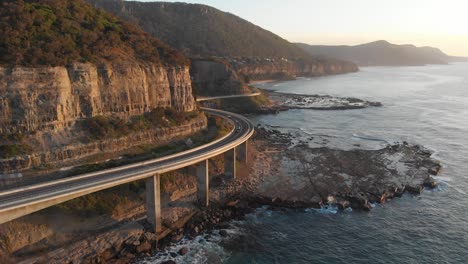 sea cliff bridge drive coastal landscape australia aerial footage sunrise