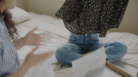 friends unboxing a gift -  new dress