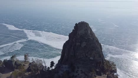 cinematic-panorama-shot-over-lake-baikal-hills-frozen-water-in-russia,-famous-baikal-lake