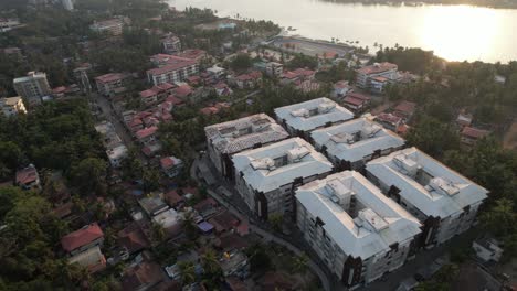 Aerial-view-of-Mangaluru's-Skate-city,-Sultan-Bathery-Ferry-Service,-the-Gurupura-River,-and-nearby-residences-and-apartments