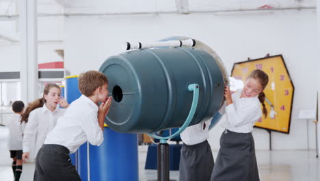 kids playing with an air cannon at a science activity centre