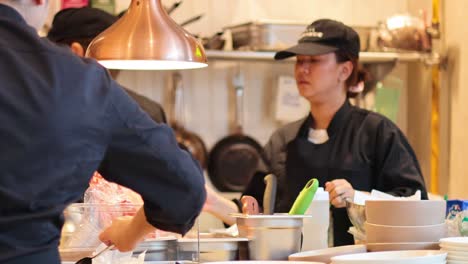 chefs working together in a busy kitchen