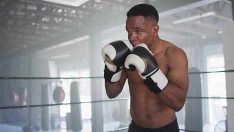 video of fit african american man boxing at gym