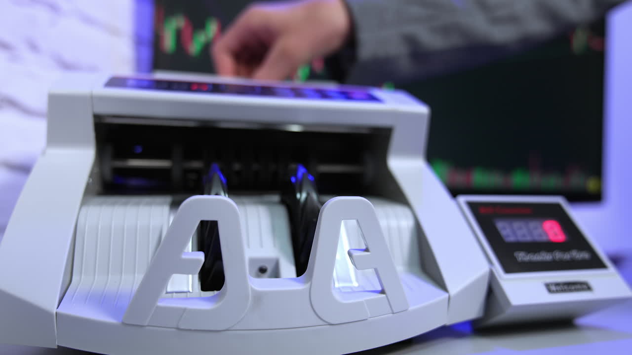 Money counting equipment for paper money calculation. Automatic mechanism for bank financial operations.