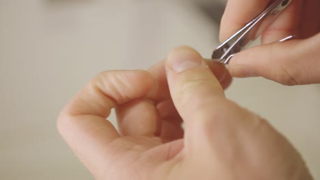 cutting nails with nail clipper - close up