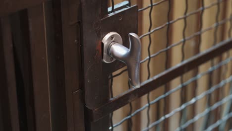 Close-up-of-old-vintage-elevator-going-up-and-arriving-at-floor