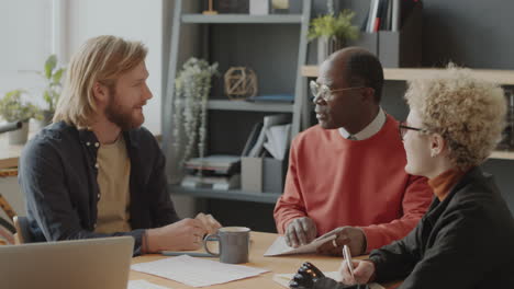 multiethnic team discussing business project on meeting