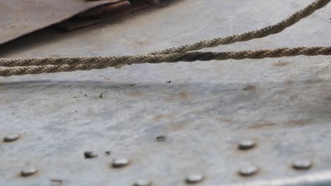 rusty metal surface with rope