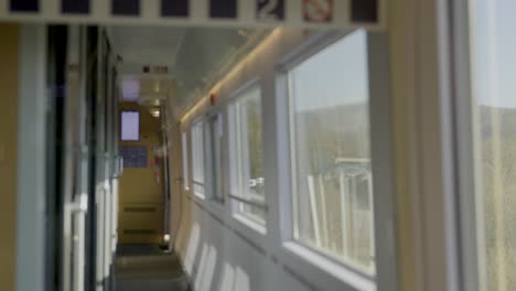 inside a driving german ice high-speed train, a view of a modern, sleek corridor