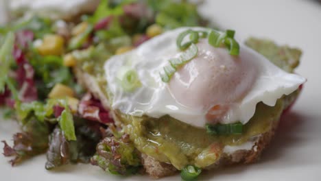 avocado toast with poached egg and salad