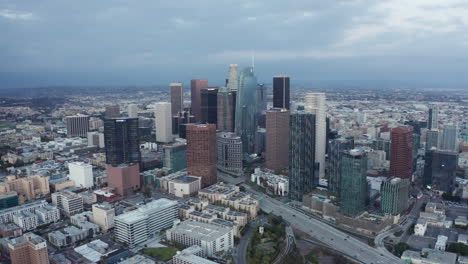 static shot of dtla skyline and highway traffic during blue hour