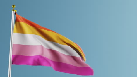 video de ondear la bandera del orgullo lesbiano contra un fondo azul