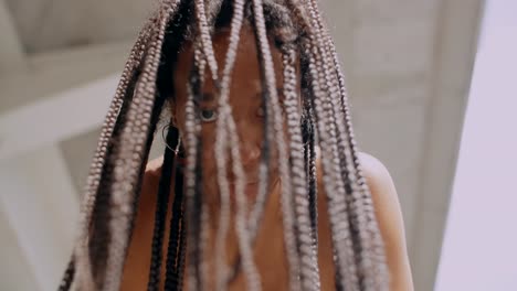 close-up of a woman with braids