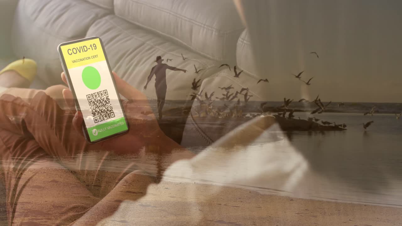 animación de una mujer caucásica con teléfono inteligente sobre un hombre caucásico en la playa