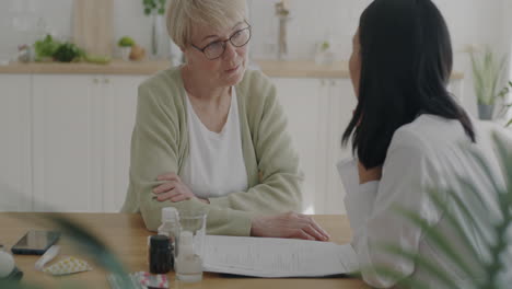 doctor discussing medical records with patient