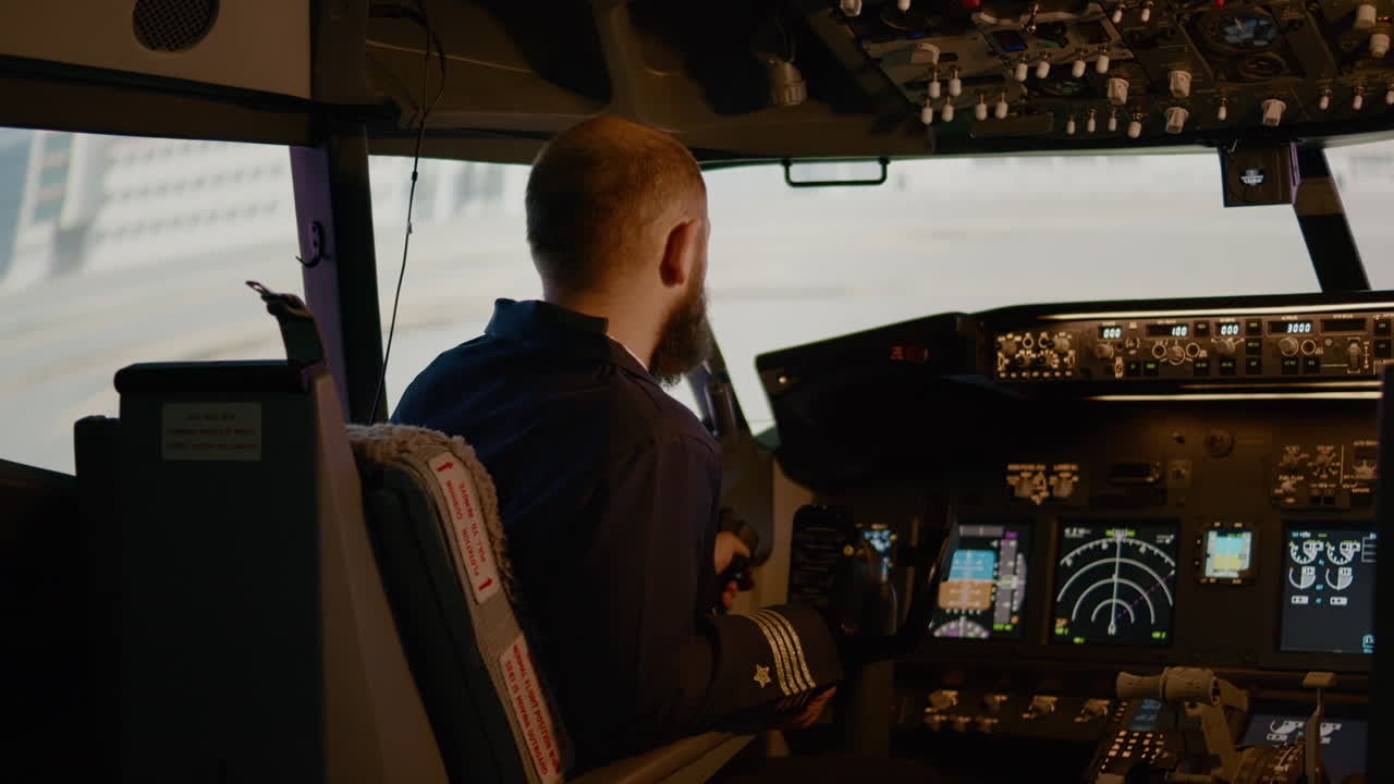 Portrait of airplane captain preparing to fly aircraft in cockpit
