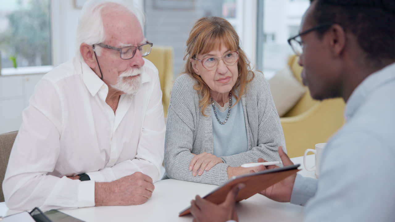 Mature couple planning with a male financial