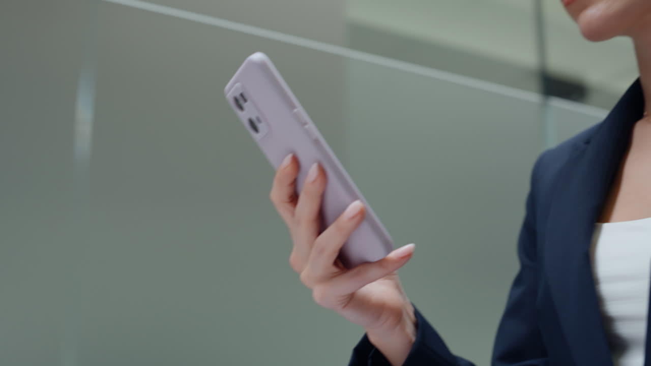 Strolling businesswoman reading sms walking empty hall closeup. Executive online