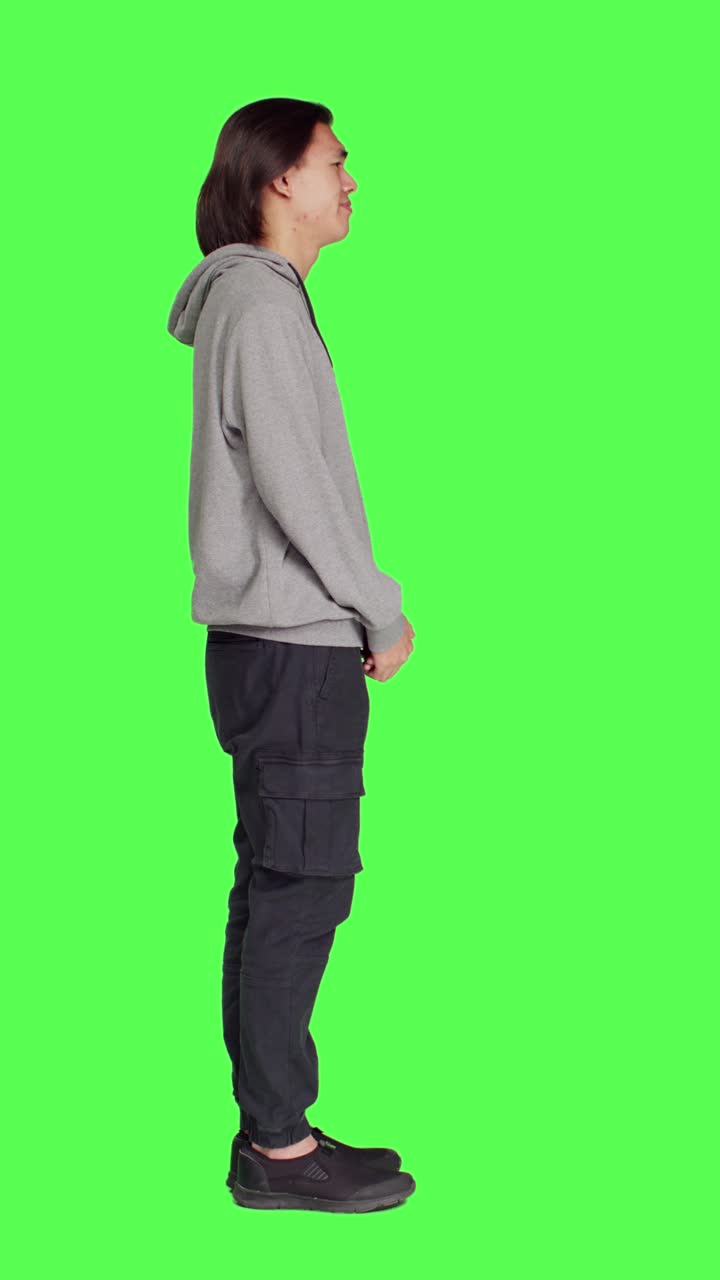 Profile of young model doing no sign on camera