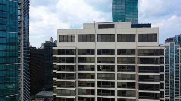 Aerial view ascending in front of a building, revealing the Streeterville skyline of Chicago, USA