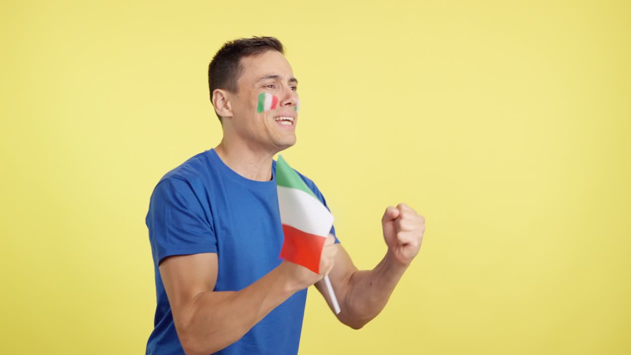 Nervous italian supporter during an exciting match looking away